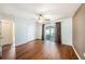 Spacious bedroom featuring wood floors, ceiling fan, closet and sliding glass doors to screened porch at 3443 Fyfield Court, Land O Lakes, FL 34638