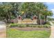 Suncoast Pointe community entrance sign with lush landscaping and stately architectural details at 3443 Fyfield Court, Land O Lakes, FL 34638