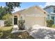 Charming single-story home featuring a two-car garage, well-maintained lawn and a welcoming entrance at 3443 Fyfield Court, Land O Lakes, FL 34638