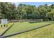 Community playground featuring swings and modern equipment on a well-maintained artificial turf surface at 3443 Fyfield Court, Land O Lakes, FL 34638