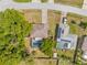 Overhead view of home, pool, and nearby houses showcases a residential neighborhood setting at 3485 Dothan Ave, Spring Hill, FL 34609