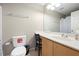 Functional bathroom with a toilet, vanity with sink, and a shower/tub combo at 3485 Dothan Ave, Spring Hill, FL 34609