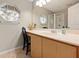 Bathroom features dual sinks and an octagonal window above the vanity at 3485 Dothan Ave, Spring Hill, FL 34609