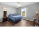Bright bedroom featuring a bed, window with natural light, and a desk for studying at 3485 Dothan Ave, Spring Hill, FL 34609