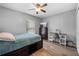 Comfortable bedroom with a bed, desk, and dresser; perfect for relaxation and productivity at 3485 Dothan Ave, Spring Hill, FL 34609