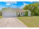 Charming single-Gathering home with a manicured lawn and a two-car garage at 3485 Dothan Ave, Spring Hill, FL 34609