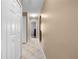Neutral hallway with multiple doorways and neutral flooring at 3485 Dothan Ave, Spring Hill, FL 34609