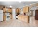 Kitchen features tile floors, appliances, and wood cabinets at 3485 Dothan Ave, Spring Hill, FL 34609
