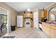 Kitchen features tile floors, appliances, wood cabinets, and a sliding glass door at 3485 Dothan Ave, Spring Hill, FL 34609