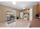 This home features a bright kitchen with tile flooring and a sliding glass door leading to the outdoor patio at 3485 Dothan Ave, Spring Hill, FL 34609