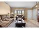 Cozy living room with two sofas, a bay window, and a neutral color scheme for a relaxing atmosphere at 3485 Dothan Ave, Spring Hill, FL 34609