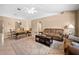 Spacious living room featuring tile flooring, comfortable seating, and arched doorways at 3485 Dothan Ave, Spring Hill, FL 34609