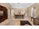 Comfortable living room with tile flooring, arched doorways, and dining area at 3485 Dothan Ave, Spring Hill, FL 34609