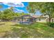 Enjoy the beautiful backyard with a screened-in pool, perfect for relaxation and outdoor entertainment at 3485 Dothan Ave, Spring Hill, FL 34609