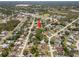 Aerial view of a residential neighborhood, displaying the layout of homes and surrounding greenery at 3529 Orion Rd, Spring Hill, FL 34606