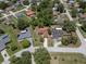 An aerial view of a single Gathering home featuring mature landscaping and a long driveway at 3529 Orion Rd, Spring Hill, FL 34606