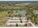 Aerial view of a community park with tennis courts, playgrounds, and ample parking at 3529 Orion Rd, Spring Hill, FL 34606