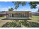 Expansive backyard featuring a screened-in patio, perfect for outdoor enjoyment and entertaining at 3529 Orion Rd, Spring Hill, FL 34606