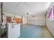 Spacious garage with painted floors and work bench, offering ample parking and storage at 3529 Orion Rd, Spring Hill, FL 34606