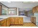 Spacious kitchen featuring counter seating open to the adjacent living area at 3529 Orion Rd, Spring Hill, FL 34606