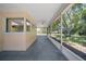 Relaxing screened patio with ceiling fan overlooks the spacious and lush backyard at 3529 Orion Rd, Spring Hill, FL 34606