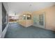 Covered screened-in patio with ceiling fan, offering a relaxing outdoor space with views of the backyard at 3529 Orion Rd, Spring Hill, FL 34606