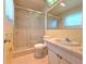 Bathroom featuring a shower with glass door and a tile countertop at 3605 100Th N Ter, Pinellas Park, FL 33782