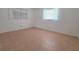 Bedroom with window, tile floors, and neutral paint scheme at 3605 100Th N Ter, Pinellas Park, FL 33782