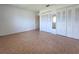 Bedroom with tile flooring, natural light, and large closets at 3605 100Th N Ter, Pinellas Park, FL 33782