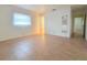Bright bedroom with tile floors, natural light, and closet at 3605 100Th N Ter, Pinellas Park, FL 33782