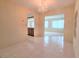 Chandelier illuminated dining room with tile floors and open layout at 3605 100Th N Ter, Pinellas Park, FL 33782