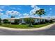 Beautiful corner lot residence featuring white siding, green shutters, and professionally maintained landscaping at 3605 100Th N Ter, Pinellas Park, FL 33782