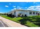 Well-maintained home featuring white siding, a newer roof, and mature landscaping at 3605 100Th N Ter, Pinellas Park, FL 33782