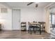 Dining area with hardwood flooring, and a door to the back patio at 3625 Oakhurst Dr, Holiday, FL 34691