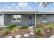 Charming home exterior featuring a well-maintained lawn and a welcoming front entrance at 3625 Oakhurst Dr, Holiday, FL 34691