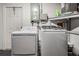 Functional laundry area with modern washer and dryer, offering convenience and efficiency at 3625 Oakhurst Dr, Holiday, FL 34691