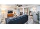 Open-concept living room with hardwood floors, a comfortable couch and updated furnishings at 3625 Oakhurst Dr, Holiday, FL 34691