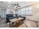 Bright living room featuring a sectional sofa, a modern rug, and a stylish coffee table at 3625 Oakhurst Dr, Holiday, FL 34691