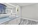 Modern bathroom features blue granite countertops, large mirror, vessel sink, and modern fixtures at 3663 Berger Rd, Lutz, FL 33548
