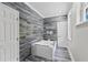 Modern bathroom features a jacuzzi tub and built-in TV at 3663 Berger Rd, Lutz, FL 33548