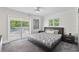 Relaxing bedroom with patio access offers a calming retreat with serene outdoor views at 3663 Berger Rd, Lutz, FL 33548