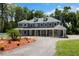 Beautifully landscaped home with covered porch and circular driveway at 3663 Berger Rd, Lutz, FL 33548