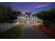 Charming multi-story home with inviting porch and landscaped yard at 3663 Berger Rd, Lutz, FL 33548