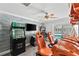 Spacious game room equipped with arcade games and racing simulators, perfect for entertainment at 3663 Berger Rd, Lutz, FL 33548