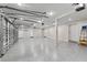 Spacious three car garage with epoxy flooring, and ample room for storage and projects at 3663 Berger Rd, Lutz, FL 33548