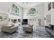Bright living room featuring soaring ceilings and expansive windows at 3663 Berger Rd, Lutz, FL 33548