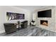 Cozy living room featuring a built-in aquarium, fireplace, and modern decor at 3663 Berger Rd, Lutz, FL 33548