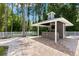 Outdoor bar with stone accents provides a great outdoor entertainment space and backyard views at 3663 Berger Rd, Lutz, FL 33548