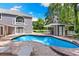 In-ground pool and outdoor bar area create an ideal outdoor entertainment space at 3663 Berger Rd, Lutz, FL 33548