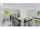 Upstairs hallway features high ceilings and iron railing overlooking the first floor at 3663 Berger Rd, Lutz, FL 33548